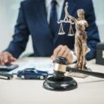 Current image: Gavel, car keys, and accident report symbolizing California insurance law