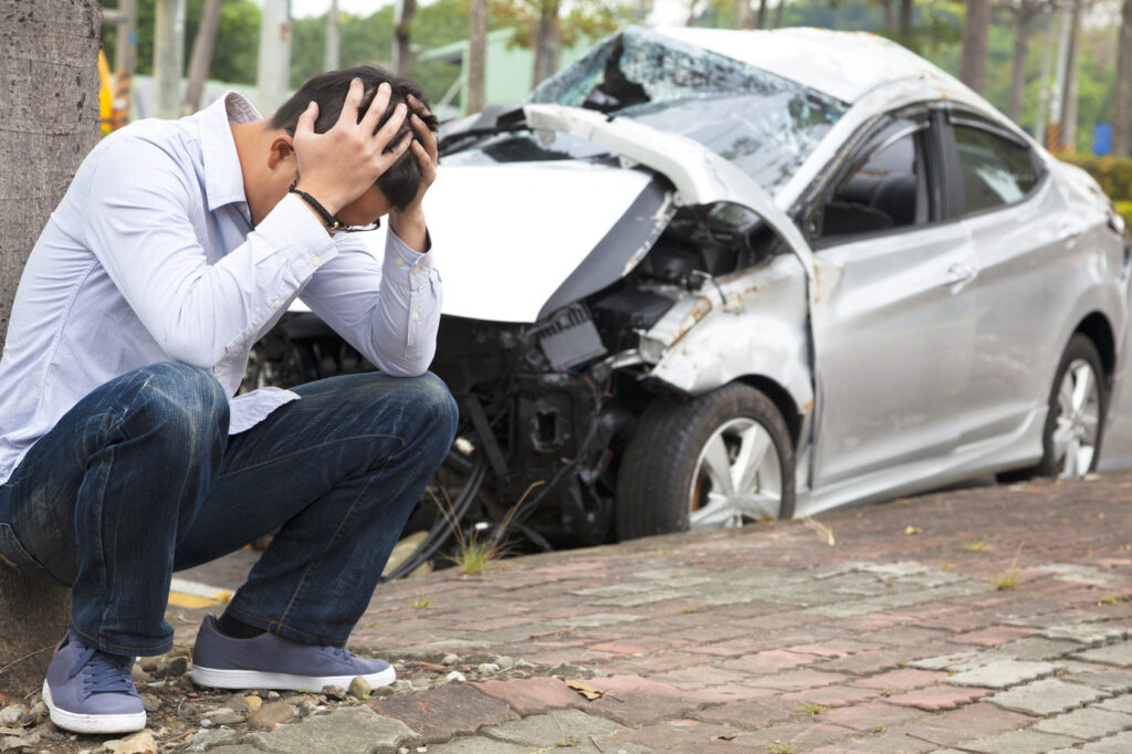 Current image: Car accident scene in San Diego with lawyer taking photos for evidence