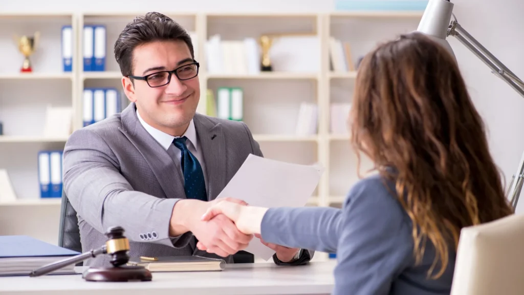 Current image: Personal injury attorney discussing settlement options in Dallas office