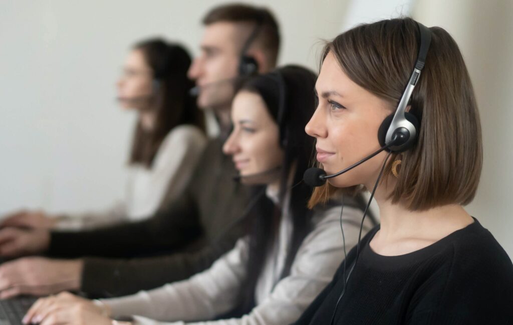 Illustration of National General Insurance customer service representative assisting a policyholder on phone call