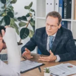 Current image: Personal injury attorney discussing settlement options in Dallas office