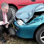 Current image: Texas auto insurance lawyer reviewing client’s accident claim documents