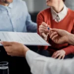 Current image: Photo of legal team consulting on National General Insurance customer service California bad faith claim