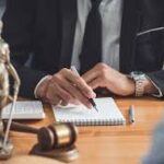 Current image: Photo of legal team consulting on National General Insurance customer service New York bad faith claim