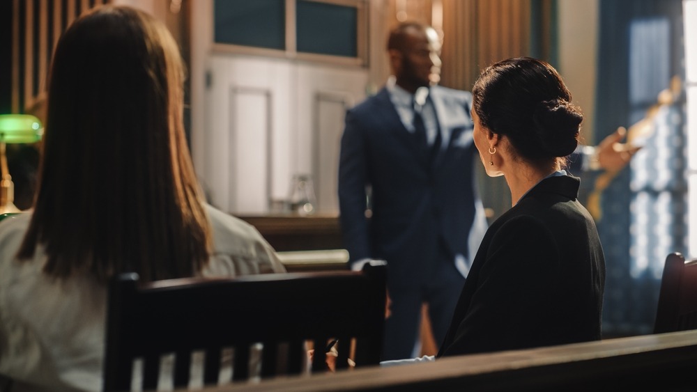 lawyer reviewing auto insurance claim documents in Philadelphia courtroom