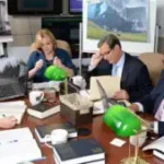 Current image: auto insurance attorney in Philadelphia discussing case with client in law office