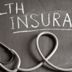Current image: health insurance quotes USA medical insurance coverage documents on desk